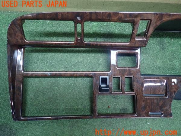 3UPJ=9227890632]ハイエースワゴン(KZH106W)純正 木目調パネル メーター・オーディオパネル 中古_2