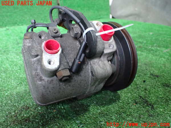 1UPJ-9239056025]ジムニー(JA22W)エアコンコンプレッサー 中古_2